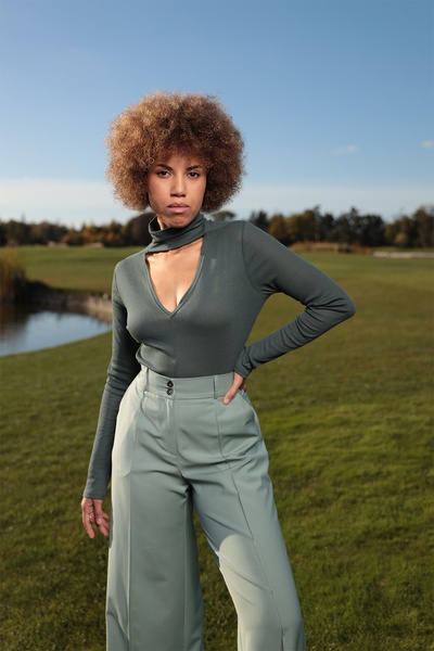 Green silk turtleneck with a cut