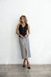 Skirt with a cut, color of a houndstooth s